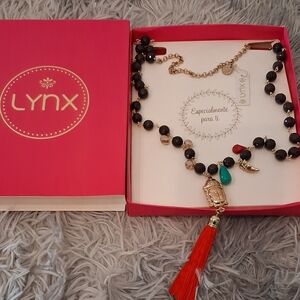 Black and Gold Necklace with Red and Green Charms